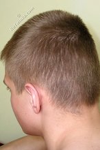 Blond-haired twink takes off his socks on camera