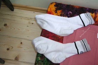 Blond-haired twink takes off his socks on camera