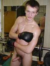 Big-dicked twink boy shadowboxing completely naked