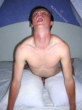 Red-faced twink squeezing out his massive load