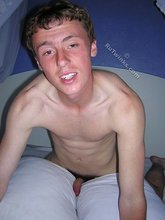 Red-faced twink squeezing out his massive load