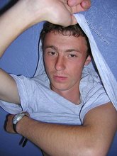 Green-eyed red-faced twink takes off his shirt