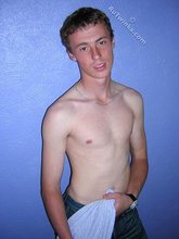 Green-eyed red-faced twink takes off his shirt