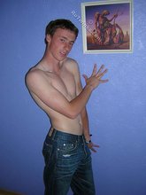 Green-eyed red-faced twink takes off his shirt