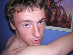 Green-eyed red-faced twink takes off his shirt