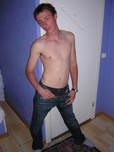 Green-eyed red-faced twink takes off his shirt