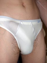Dark-haired twink shows off his thick cock up close