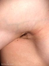 Dark-haired twink shows off his thick cock up close