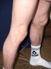 Dark-haired twink shows off his thick cock up close