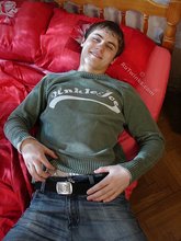 Dark-haired dude takes off his wife-beater on camera