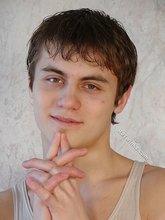 Dark-haired dude takes off his wife-beater on camera