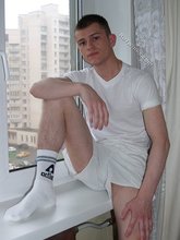 Dark-haired twink in all white decides to strip naked
