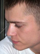 Dark-haired twink in all white decides to strip naked