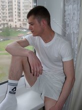 Dark-haired twink in all white decides to strip naked