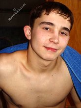 Dark-haired twink posing completely naked in the bathroom