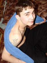 Dark-haired twink posing completely naked in the bathroom