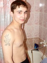Dark-haired twink posing completely naked in the bathroom