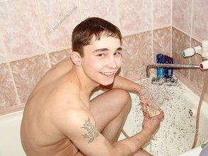 Dark-haired twink posing completely naked in the bathroom
