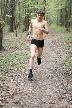 Jacked-up dude does sporty stuff and poses naked in the woods
