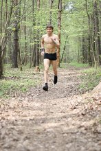 Jacked-up dude does sporty stuff and poses naked in the woods