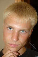 Albino-like blonde guy shows his stylish shoes