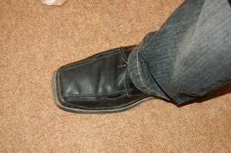 Albino-like blonde guy shows his stylish shoes