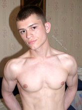 Big cock twink showing off in front of a camera