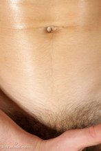 Oily dark-haired twink stroking his meaty cock on cam