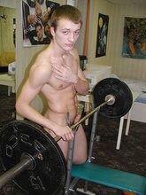 Big-dicked twink gets oily and starts working out naked