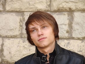 Twink dressed in all black starts undressing on cam