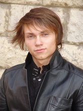 Twink dressed in all black starts undressing on cam