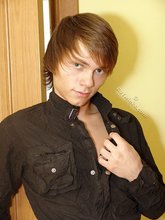 Twink dressed in all black starts undressing on cam