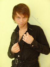 Twink dressed in all black starts undressing on cam