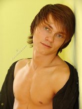 Twink dressed in all black starts undressing on cam