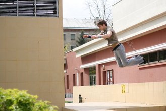 Jacked-up parkour dude posing shirtless outdoors