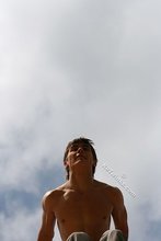 Jacked-up parkour dude posing shirtless outdoors