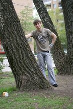 Jacked-up parkour dude posing shirtless outdoors