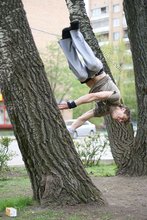 Jacked-up parkour dude posing shirtless outdoors