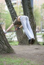 Jacked-up parkour dude posing shirtless outdoors