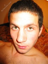 Dark-haired hottie jerking his massive cock up close