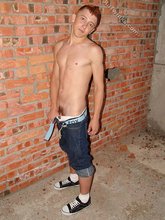 Redheaded twink revealing his enticing anal hole