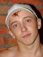 Redheaded twink revealing his enticing anal hole