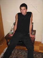 Cool dude takes off his black sleeveless t-shirt