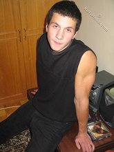 Cool dude takes off his black sleeveless t-shirt