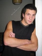 Cool dude takes off his black sleeveless t-shirt