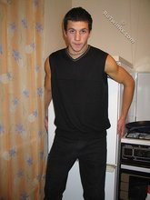 Cool dude takes off his black sleeveless t-shirt