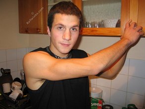 Cool dude takes off his black sleeveless t-shirt
