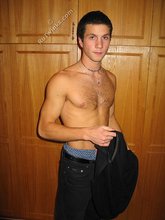 Cool dude takes off his black sleeveless t-shirt