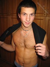 Cool dude takes off his black sleeveless t-shirt