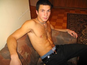 Cool dude takes off his black sleeveless t-shirt